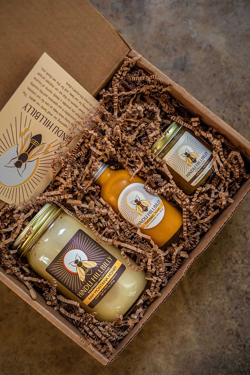 A gift box with raw honey, tonic, and herbal honey