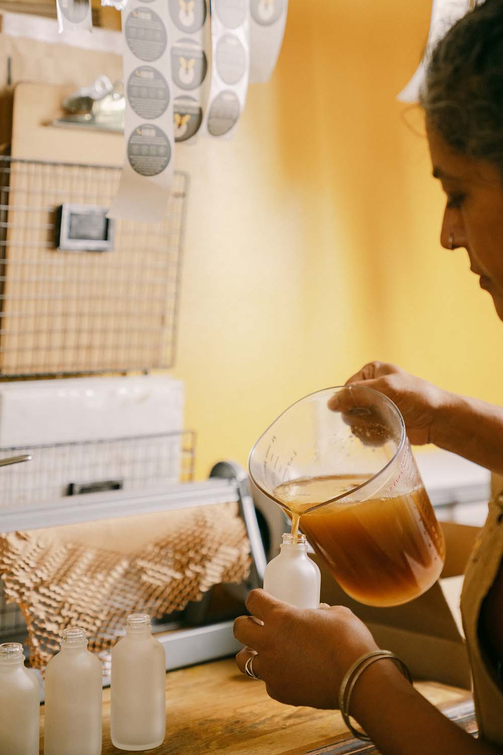woman-pouring-honey-into-jar.jpg
